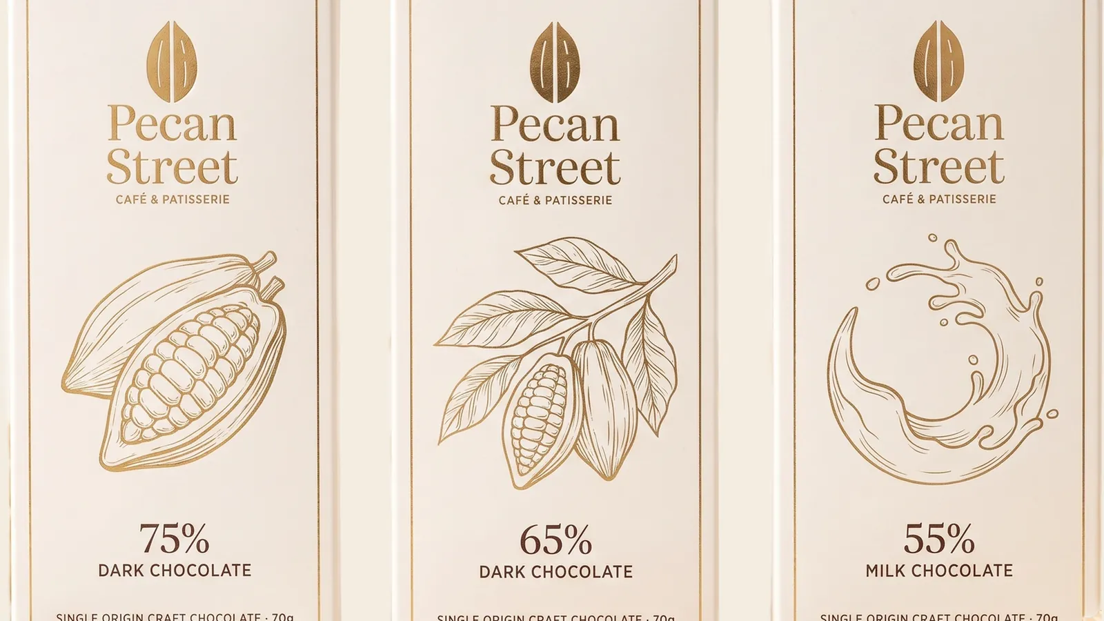Three chocolate bar cartons at 75%, 65% and 55% cocoa, each with a different botanical line drawing